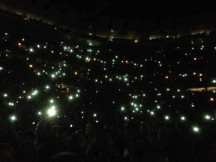 phones lit up in audience