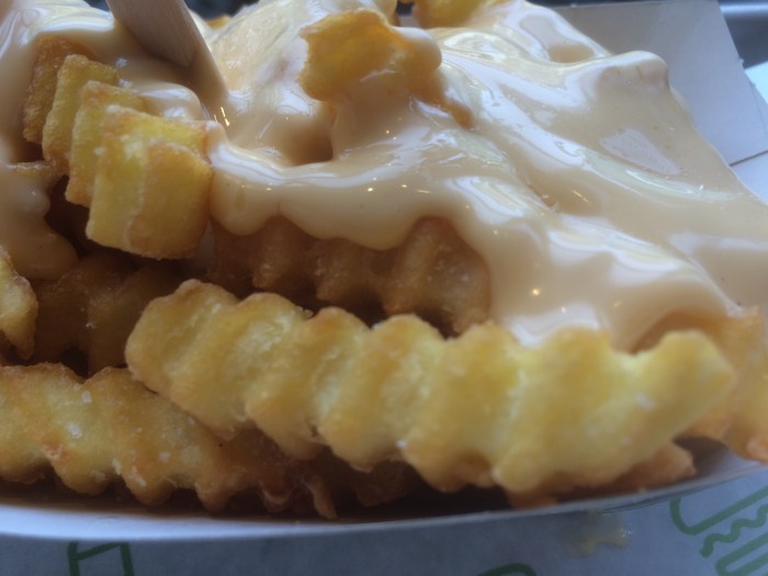cheese covered crinkle cut fries