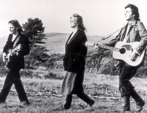 PKT4144 - 303020 PAUL MCCARTNEY SINGER 1977 Paul McCartney with his wife Linda and Denny Laine make sweet music in the Highlands of Scotland. Danny, Linda and Paul strolling in the heather during filming of the promotional film for their new single 'Mull of Kintyre'.