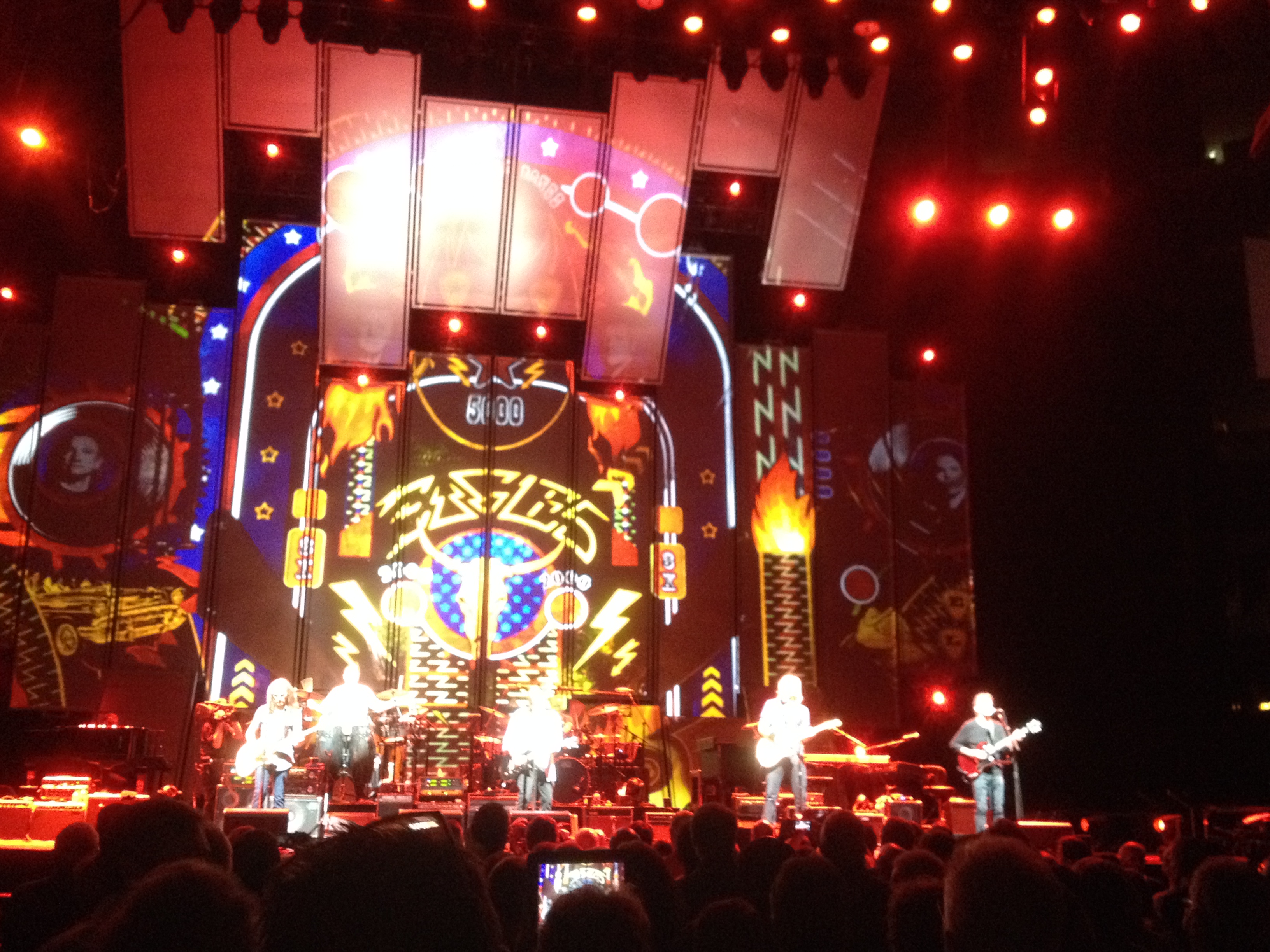 Eagles on stage with eagles logo