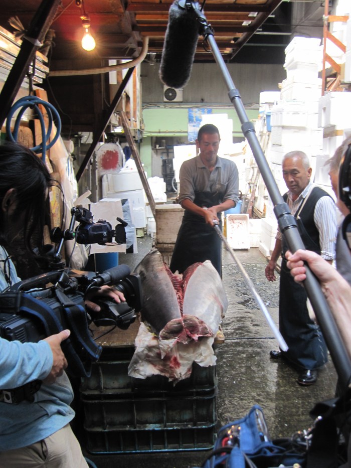 fish market tuna slices in half