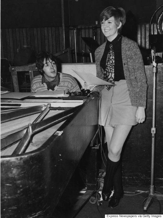 Pop singer and entertainer Cilla Black (Priscilla White) rehearses a song with Paul McCartney in a recording studio; the Beatle has written the song 'Step Inside Love', which will be the theme song for Cilla's new television show.  Original Publication: People Disc - HB0137   (Photo by Express Newspapers/Getty Images)